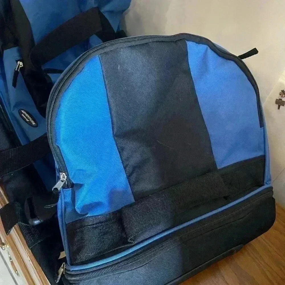 Adventure brand cargo travel‎ bag 30”L with several zipper pockets and wheels